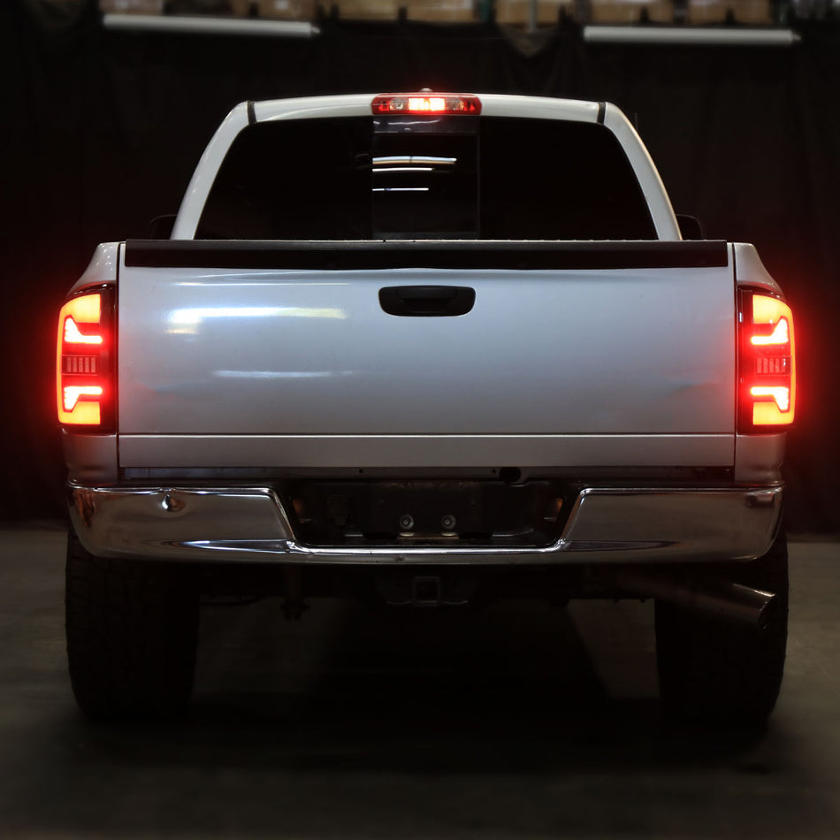 2007-2009 Dodge RAM 1500/2500/3500 White LED Bar Tail Lights (Matte Black Housing/Smoked Lens)